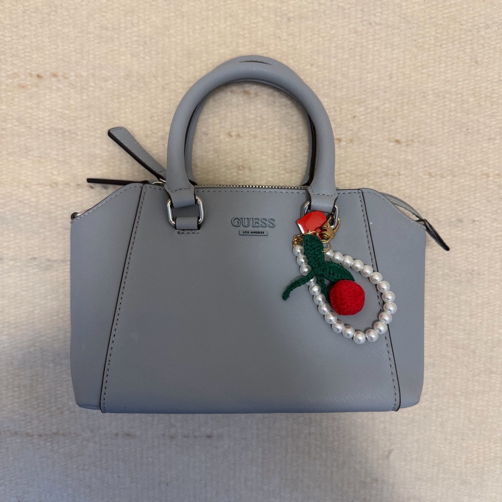 GUESS baby blue Satchel with Pearl and Cherry Charm